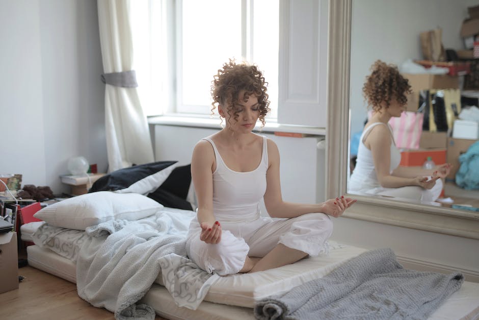 A person sitting peacefully with their legs crossed, practicing mindfulness.